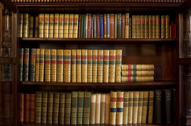 Bookshelf of antiquarian books from about the 1920's and earlier. These books are in pristine condition.